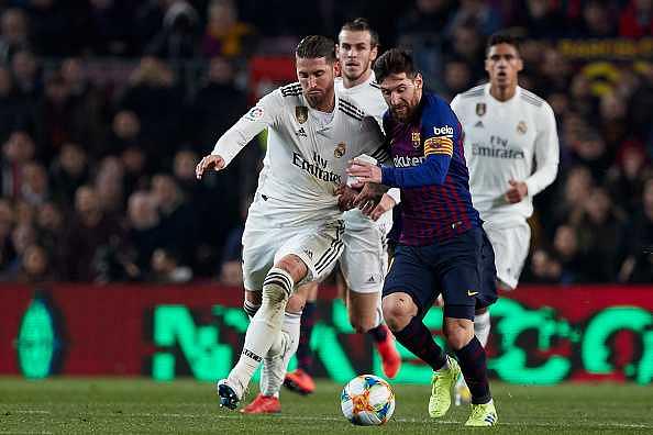 Sergio Ramos and Lionel Messi battle out for the ball