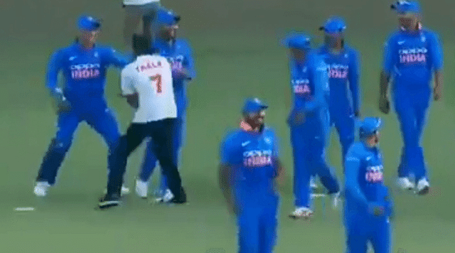 MS Dhoni chased around by an invader
