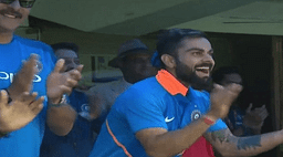 Virat Kohli celebrates as Jasprit Bumrah hits a six