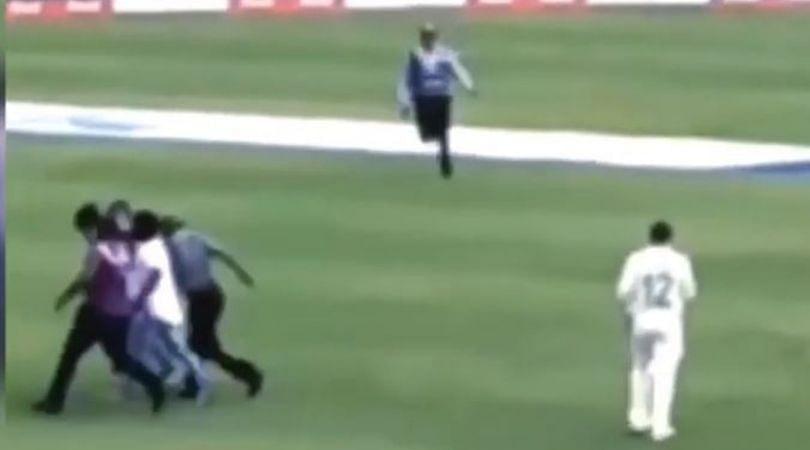 Fan invades pitch to hug Quinton De Kock an touch his feet back on his way forgets slipper, cricketer returns it to him