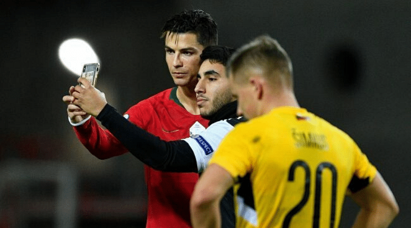 Cristiano Ronaldo stops match to take selfie with pitch invader during Portugal vs Lithuania