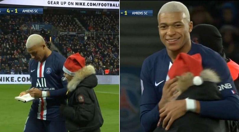 Kylian Mbappe signs an autograph for a young pitch invader in a beautiful moment during PSG vs Amiens