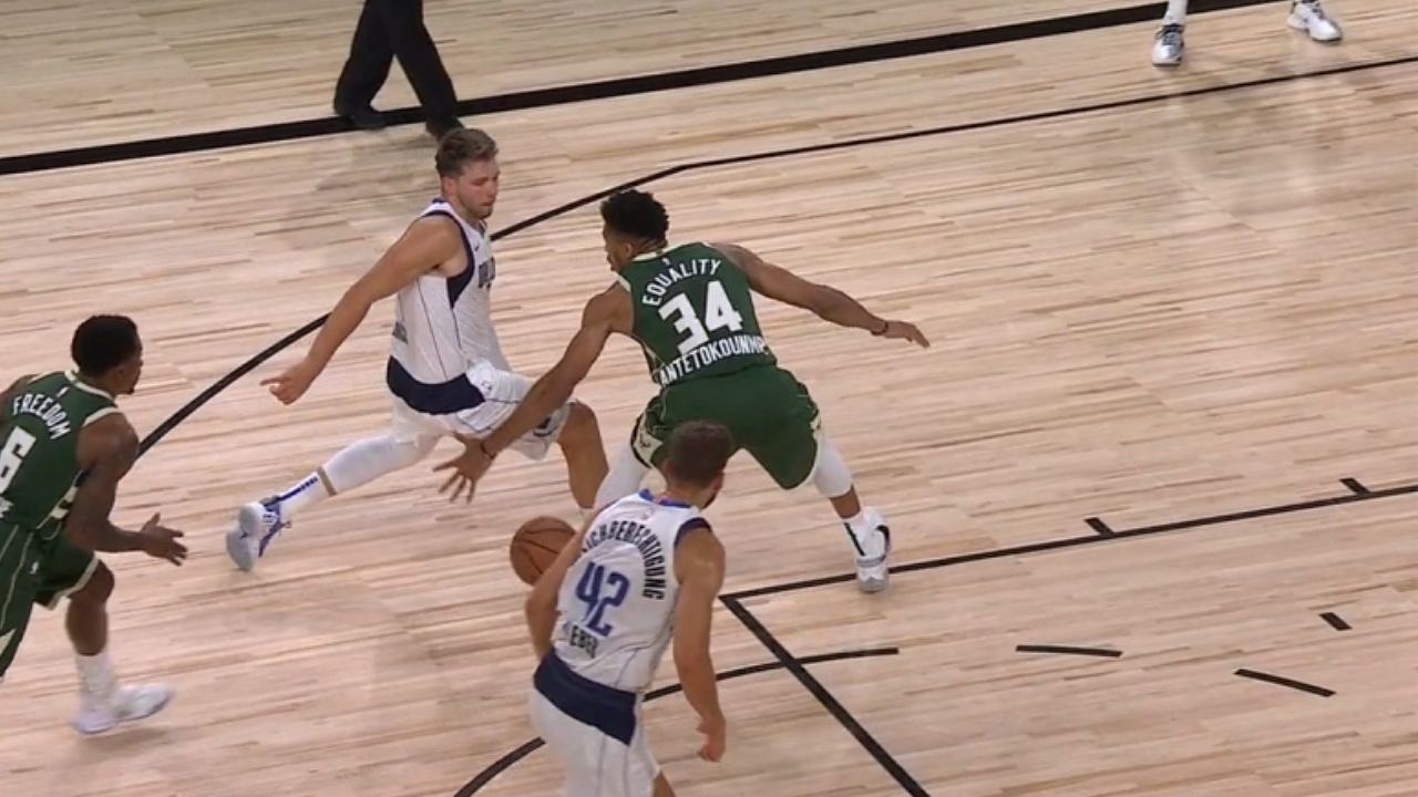 Luca Doncic makes an impressive between the legs pass against the Bucks