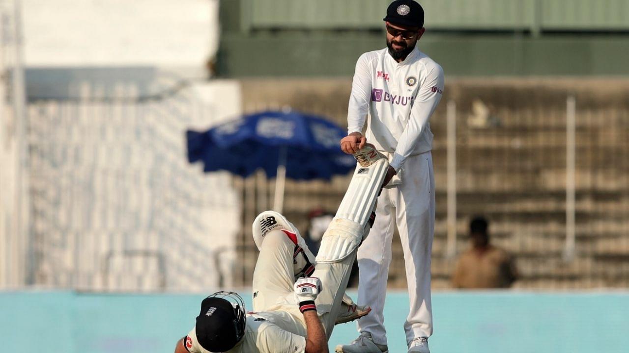 Spirit of Cricket: Virat Kohli stretches Joe Root's leg as the latter struggles with cramps in Chennai Test
