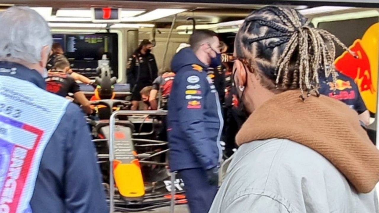 "Lewis giving the Red Bull garage a visit": Lewis Hamilton and Red Bull come face to face at Barcelona as the Mercedes star walks past Max Verstappen's car in the pit-lane