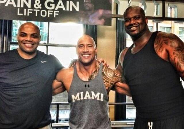 Charles Barkley fakes a 405lb bench press to beat Shaquille O'Neal in front of The Rock