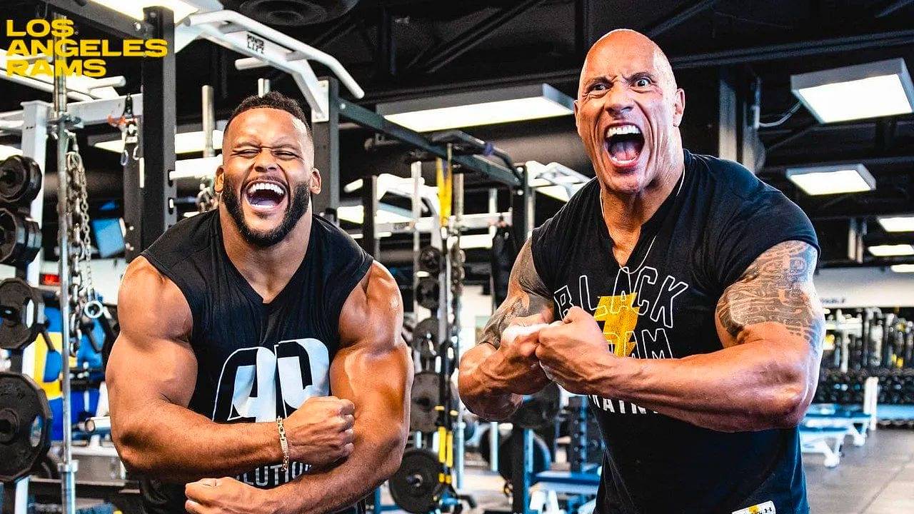 Aaron Donald and Dwayne Johnson showed off their insane strength by curling 100 pounds in a legendary workout