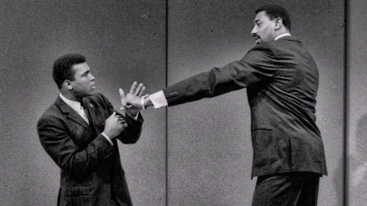 7'1" Wilt Chamberlain and 236 pound Muhammad Ali sized each other up in "rare GOAT footage"