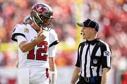 Tampa Bay Buccaneers quarterback Tom Brady (12) discusses a call with side judge Jonah Monroe (120) during the second half against the Atlanta Falcons at Raymond James Stadium