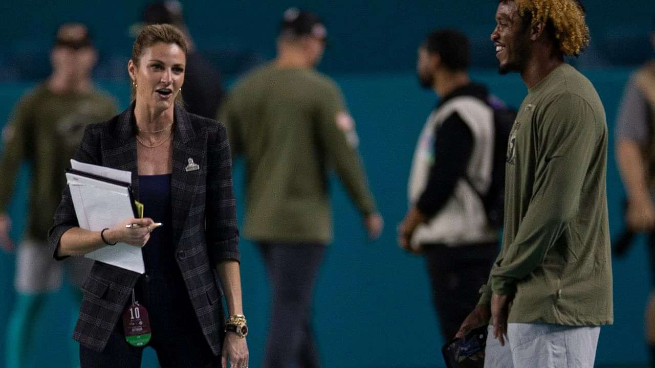 Sportscaster Erin Andrews, right, stands on the field next to