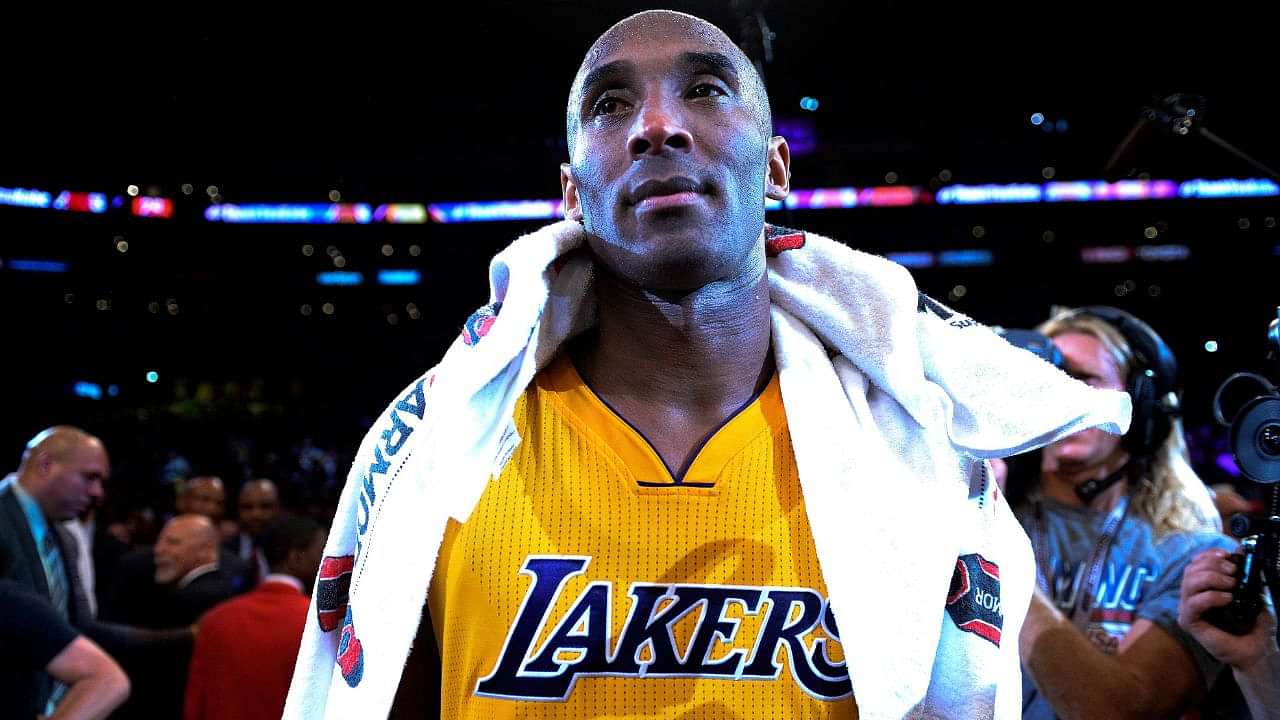 Kobe Bryant's father Joe Bryant smiles and talks to his son.JPG
