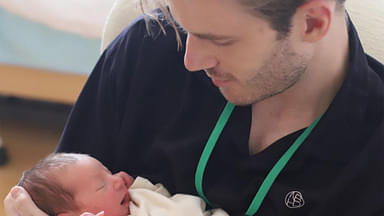 PewDiePie holding newborn son Bjorn