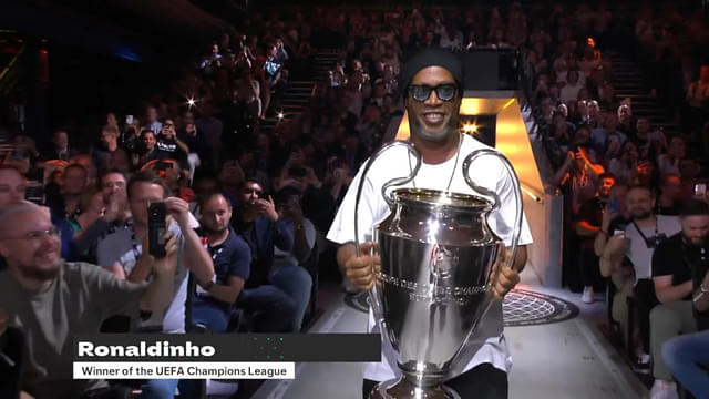 Ronaldinho with the UEFA Champions League trophy at the EAFC 24 Official Reveal Livestream.