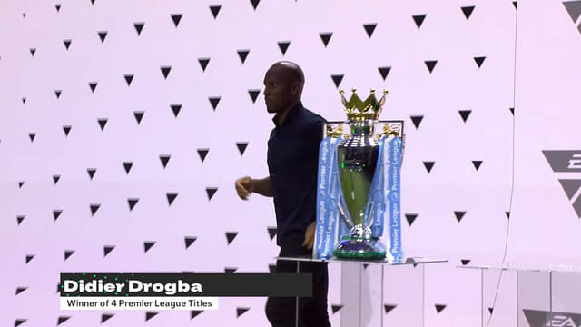 Didier Drogba brings the Premier League trophy at the EA SPORTS FC 24 Official Reveal Livestream.