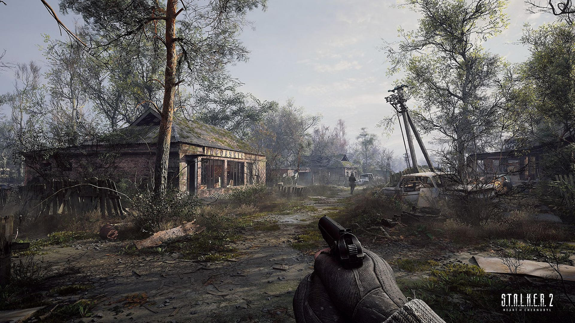 The player character holding a pistol in Stalker 2: Heart of Chornobyl