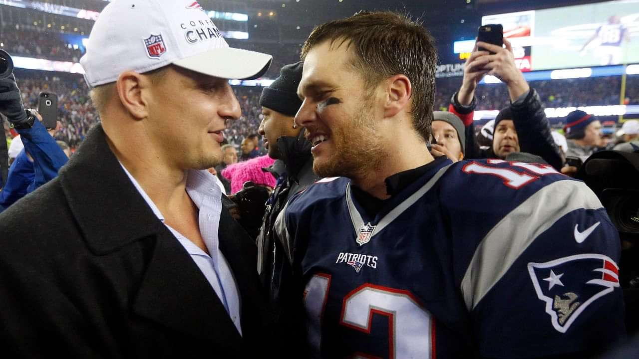 Tom Brady takes batting practice with Rob Gronkowski