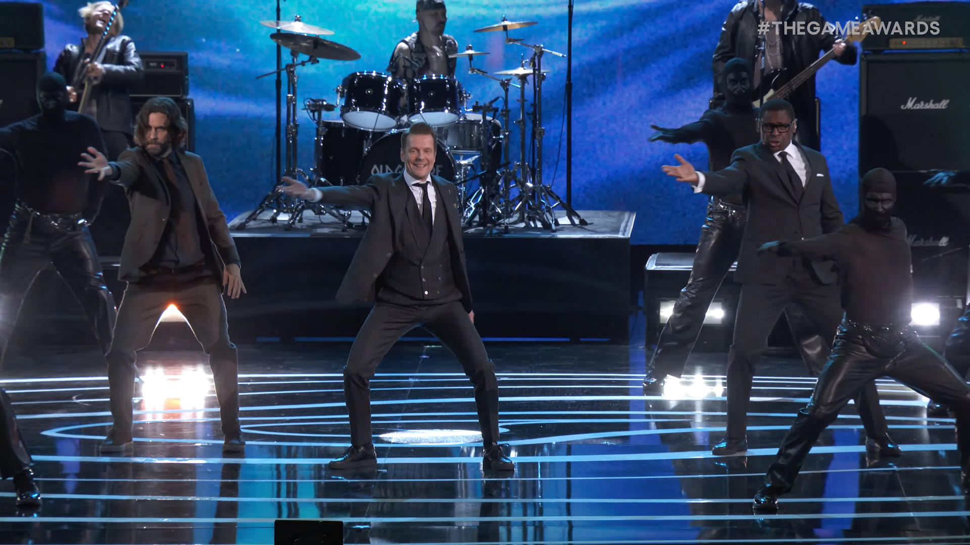An image showing Sam Lake, Ilkka Villi, and David Harewood on stage of The Game Awards 2023 dancing to Herald of Darkness