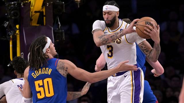 Mar 2, 2024; Los Angeles, California, USA; Los Angeles Lakers forward Anthony Davis (3) reaches in front of Denver Nuggets forward Aaron Gordon (50) for a rebound in the second half at Crypto.com Arena. Mandatory Credit: Jayne Kamin-Oncea-USA TODAY Sports