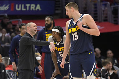 Apr 4, 2024; Los Angeles, California, USA; Denver Nuggets assistant coach David Adleman talks with guard Kentavious Caldwell-Pope (5) and center Nikola Jokic (15) in the second half against the Los Angeles Clippers at Crypto.com Arena. Mandatory Credit: Jayne Kamin-Oncea-USA TODAY Sports