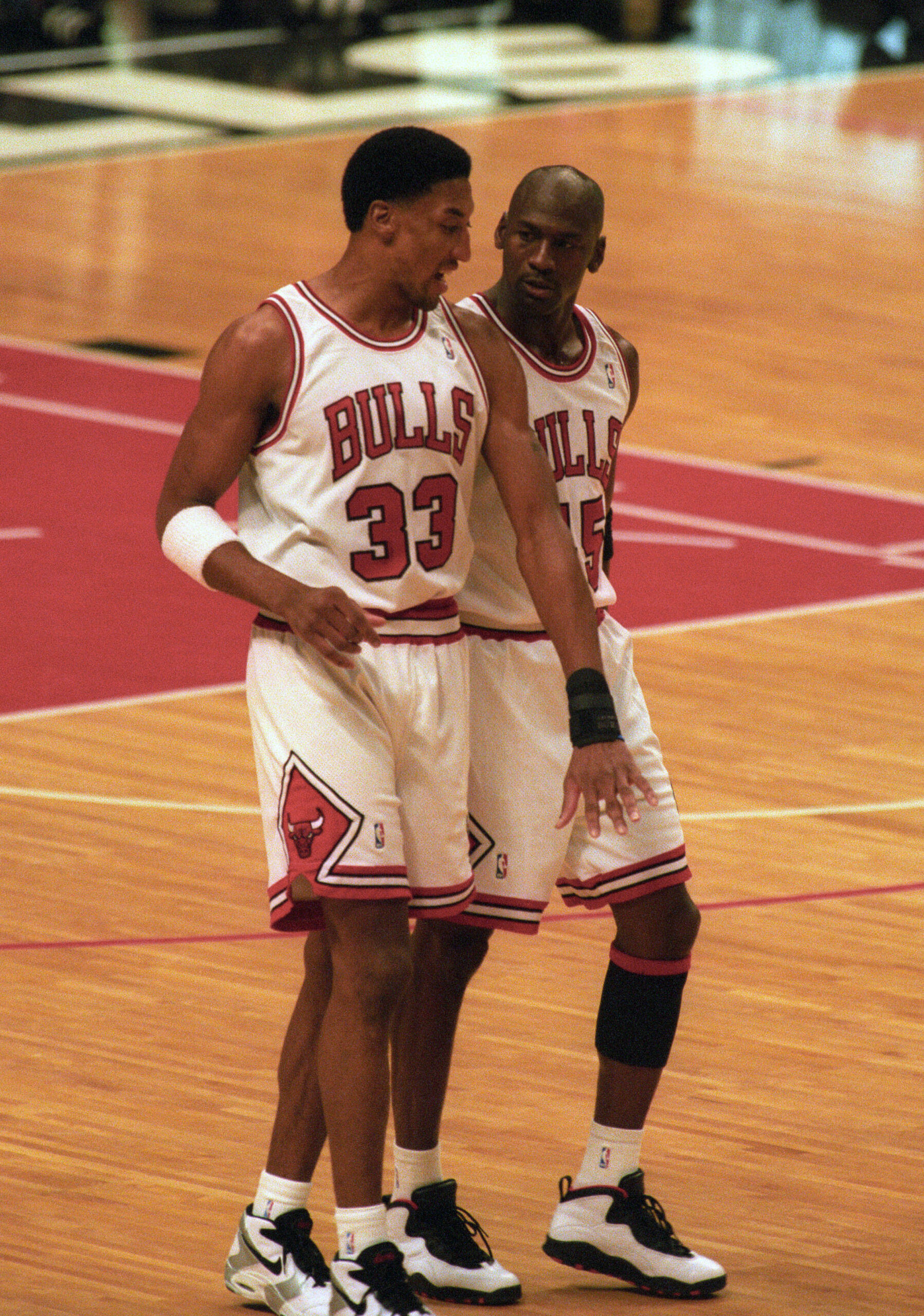Mar 30, 1995; Chicago, IL, USA; Chicago Bulls guard Michael Jordan (45) talks with forward Scottie Pippen (33) after a timeout from the game against the Boston Celtics at Chicago Stadium. The Bulls beat the Celtics 100-82. Mandatory Credit: Matthew Emmons-USA TODAY Sports