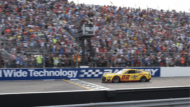 NASCAR Cup Series driver Joey Logano (22) crosses the finish line to win the Enjoy Illinois 300 at World Wide Technology Raceway at Gateway.