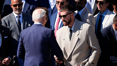President Joe Biden shakes hands with Kansas City Chiefs tight end Travis Kelce during the team's visit to the White House on May 31, 2024.