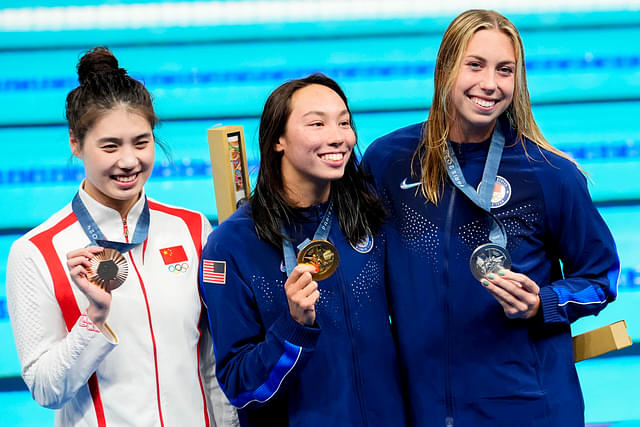 Yufei Zhang (China), Torri Huske (USA) and Gretchen Walsh (USA) in the women’s 100-meter butterfly medal ceremony during the Paris 2024 Olympic Summer Games at Paris La Défense Arena.