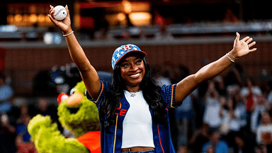 Simone Biles’ Coach Takes Subtle Swipe at Olympics Judges After Gymnast’s First Pitch for Astros