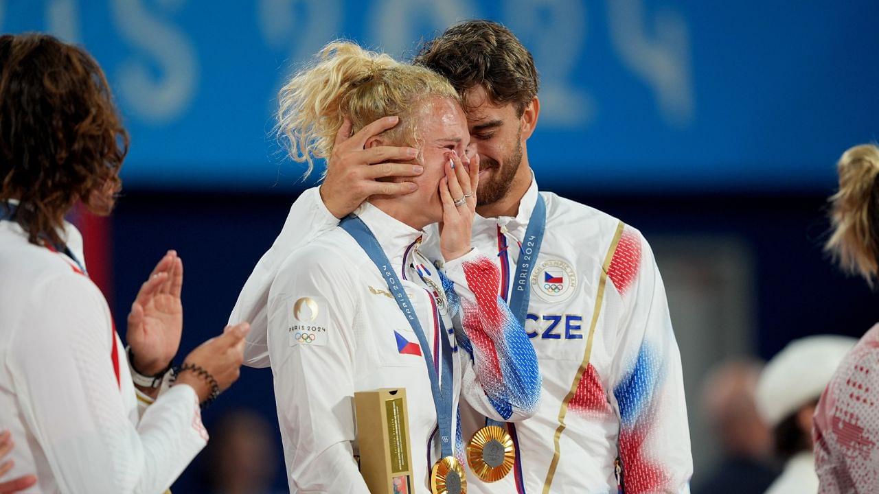 Katerina Siniakova (CZE) and Tomas Machac (CZE) celebrate after winning the mixed doubles gold medal during the Paris 2024 Olympic Summer Games at Stade Roland Garros. Mandatory Credit: Amber Searls-USA TODAY Sports