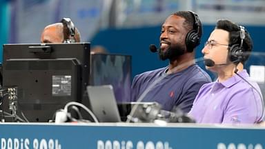 Dwyane Wade and Noah Eagle during the Paris Olympics