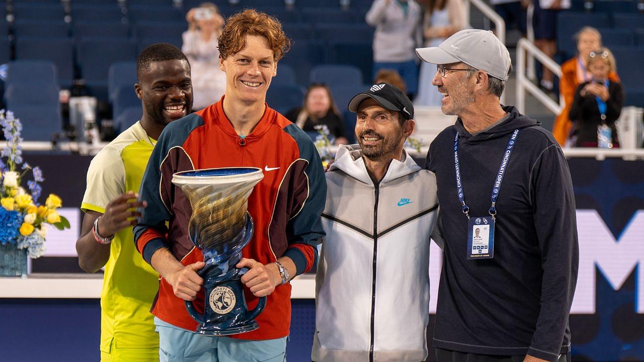 Frances Tiafoe of the United States photo bombs Jannik Sinner of Italy and his coaches, Simone Vagnozzi and Darren Cahill on day seven of the Cincinnati Open. Mandatory Credit: Susan Mullane-USA TODAY Sports