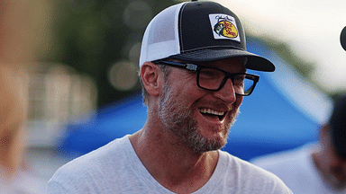 Jul 20, 2024; Hampton, VA, USA; Dale Earnhardt Jr. talks with former NASCAR driver Elliot Sadler before the 16th Annual Hampton Heat at Langley Speedway. Mandatory Credit: Peter Casey-Imagn Images