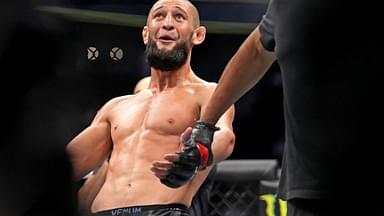 Khamzat Chimaev (red gloves) fights Kevin Holland (blue gloves) during UFC 279 at T-Mobile Arena.