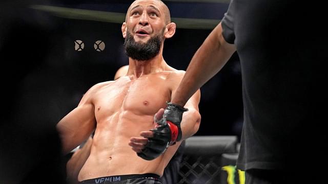 Khamzat Chimaev (red gloves) fights Kevin Holland (blue gloves) during UFC 279 at T-Mobile Arena.