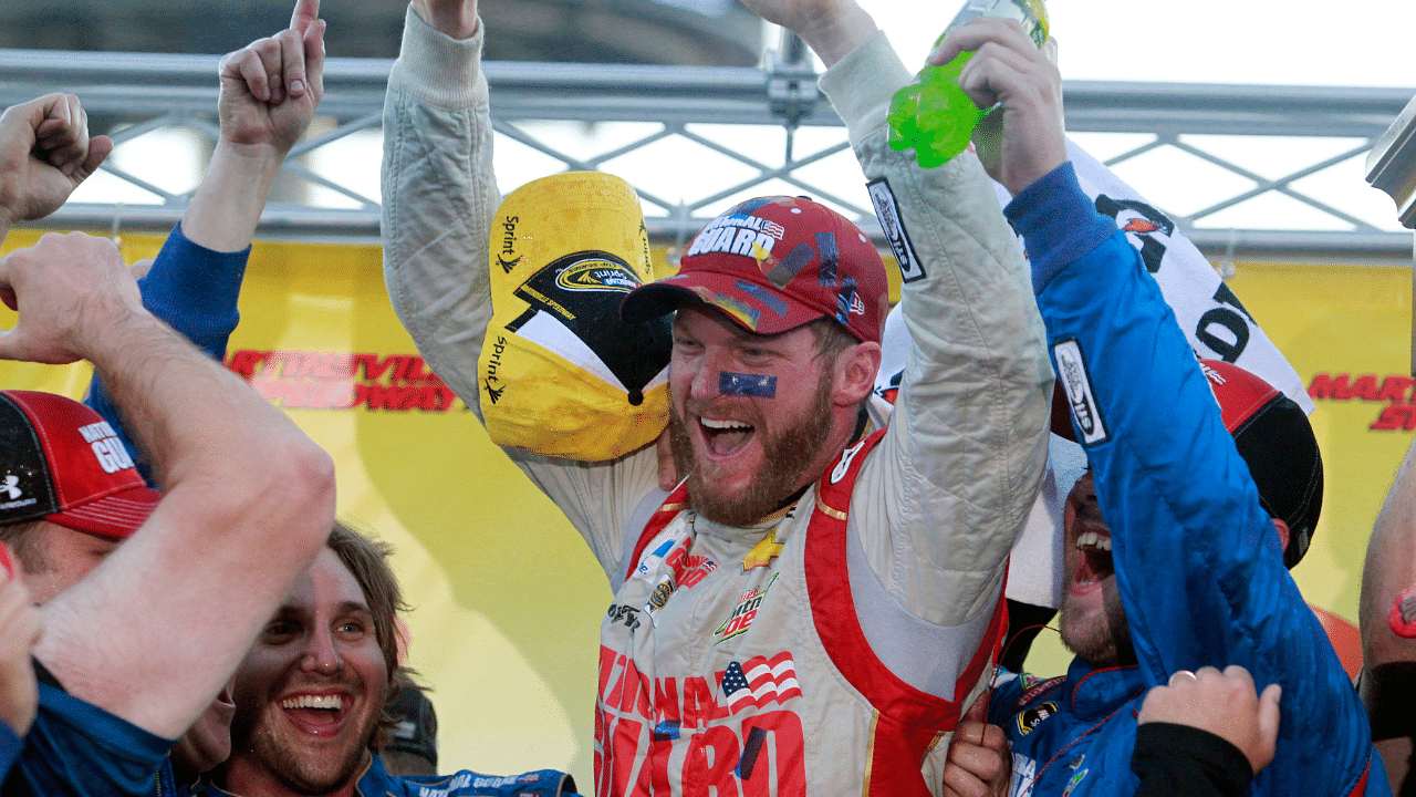 Sprint Cup Series driver Dale Earnhardt Jr. (88) celebrates winning the Goody's Headache Relief Shot 500 at Martinsville Speedway.