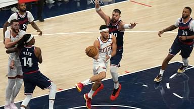 Phoenix Suns guard Devin Booker (1) is defended by LA Clippers center Ivica Zubac (40) in the first half at Intuit Dome