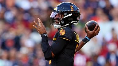 Washington Commanders quarterback Jayden Daniels (5) throws a pass during the first quarter against the Chicago Bears at Commanders Field.