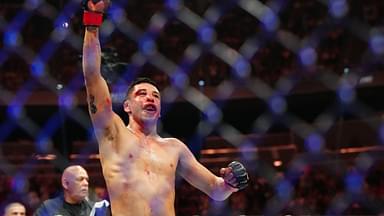 Brandon Moreno (red gloves) reacts after the fight against Alexandre Pantoja (blue gloves) during UFC 290 at T-Mobile Arena.