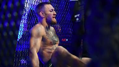 Conor McGregor reacts following an injury suffered against Dustin Poirier during UFC 264 at T-Mobile Arena.