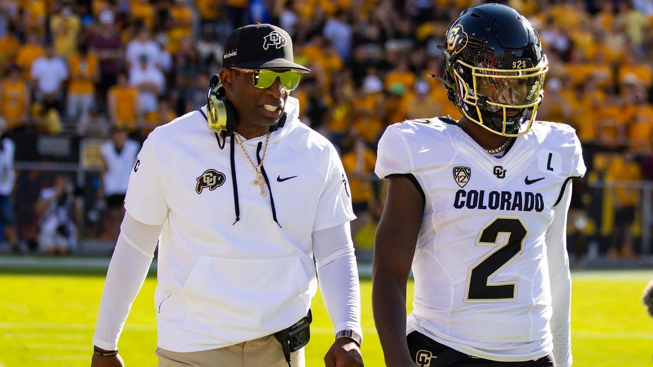 Colorado Buffaloes head coach Deion Sanders with son and quarterback Shedeur Sanders (2) against the Arizona State Sun Devils at Mountain America Stadium.