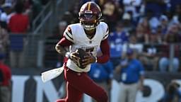 Oct 13, 2024; Baltimore, Maryland, USA; Washington Commanders quarterback Jayden Daniels (5) rolls out to pass during the second half against the Baltimore Ravens at M&T Bank Stadium.