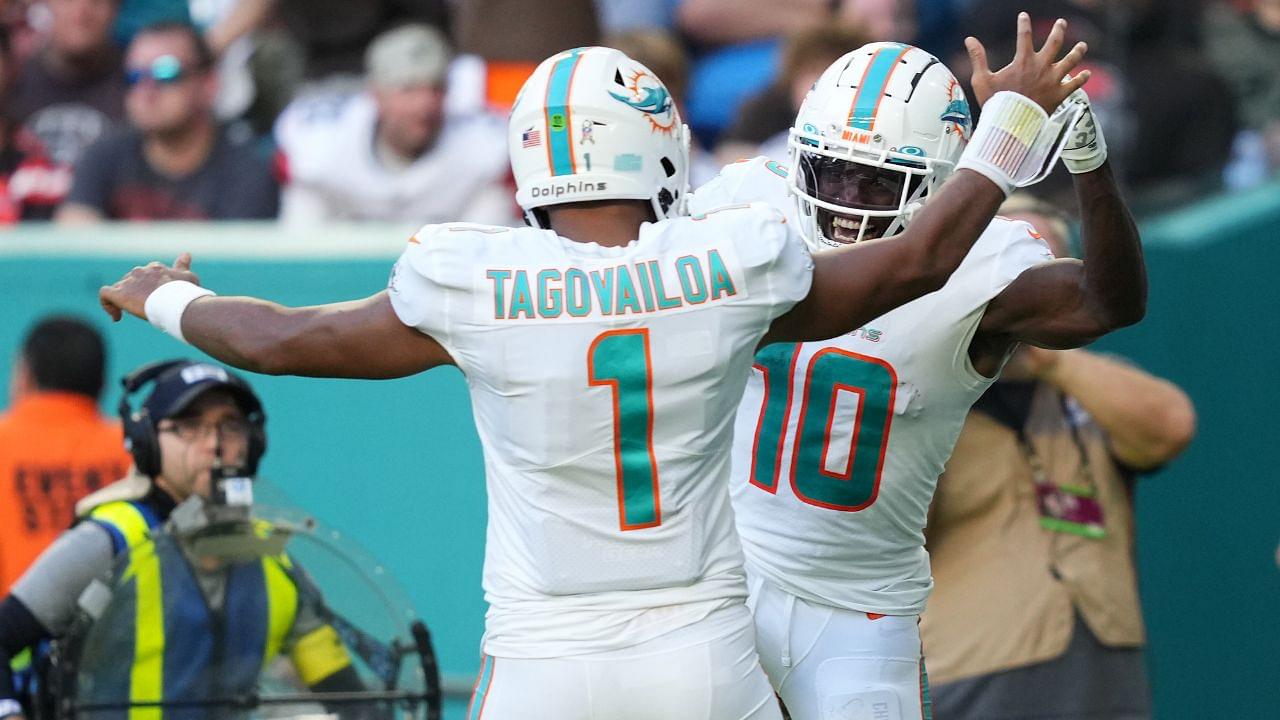 Miami Dolphins wide receiver Tyreek Hill (10) celebrates the touchdown of running back quarterback Tua Tagovailoa (1) during the second half at Hard Rock Stadium.