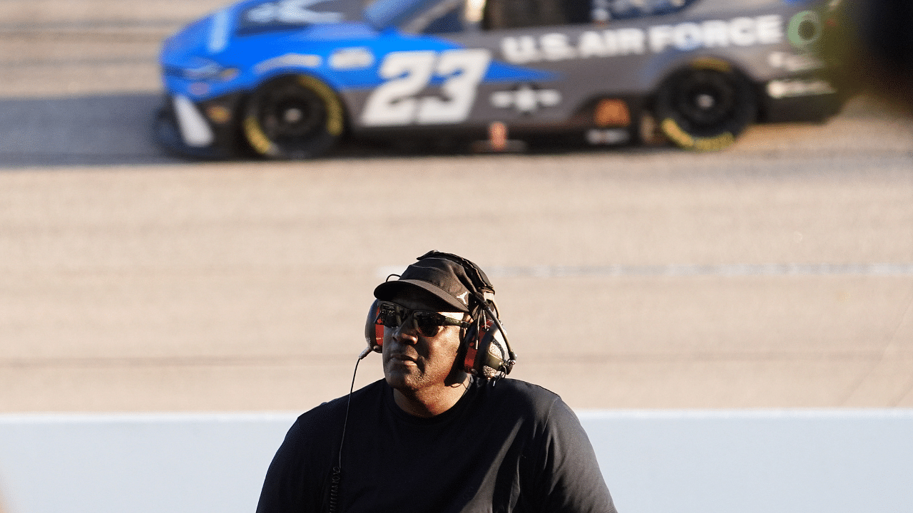 NASCAR Cup Series Team 23XI owner Michael Jordan watches a video board as NASCAR Cup Series driver Bubba Wallace (23) races during the Cook Out Southern 500 at Darlington Raceway.