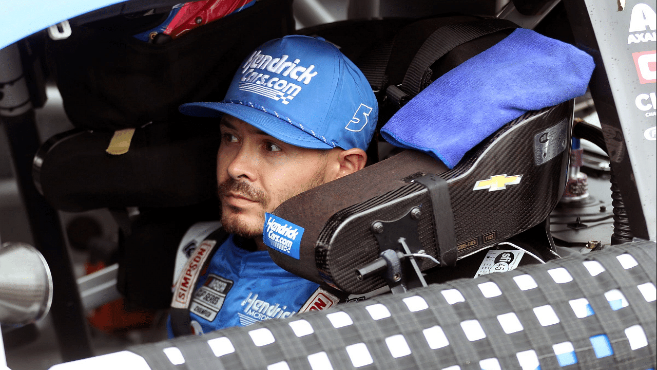 Driver for the Hendrick Motorsports Kyle Larson straps into the number 5 car before the FireKeepers Casino 400 on Sunday, Aug. 6, 2023.