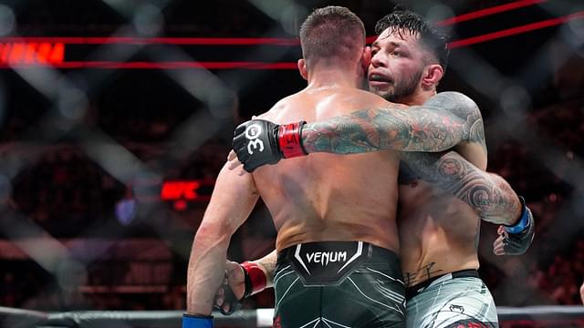 Daniel Pineda (red gloves) hugs Tucker Lutz (blue gloves) after defeating him during UFC Fight Night at AT&T Center.