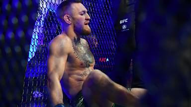 Conor McGregor reacts following an injury suffered against Dustin Poirier during UFC 264 at T-Mobile Arena.