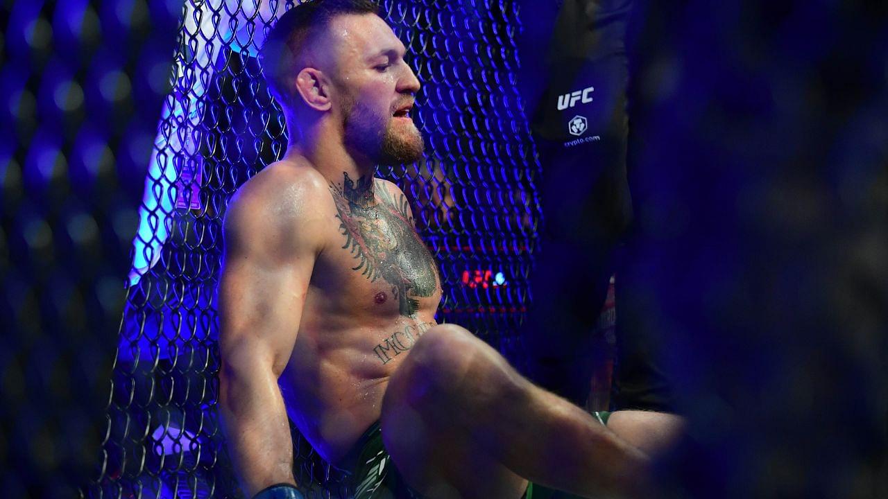 Conor McGregor reacts following an injury suffered against Dustin Poirier during UFC 264 at T-Mobile Arena.