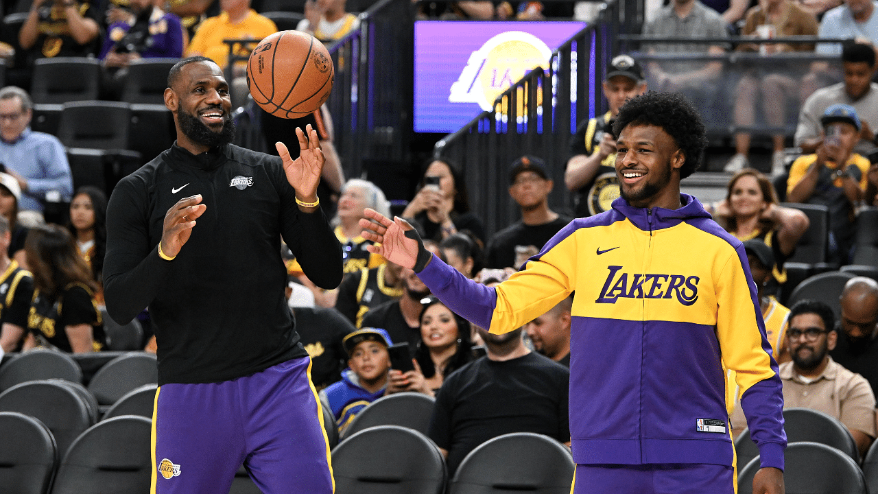 Los Angeles Lakers forward LeBron James (23) warms up with guard Bronny James (9) before the preseason game against the Golden State Warriors