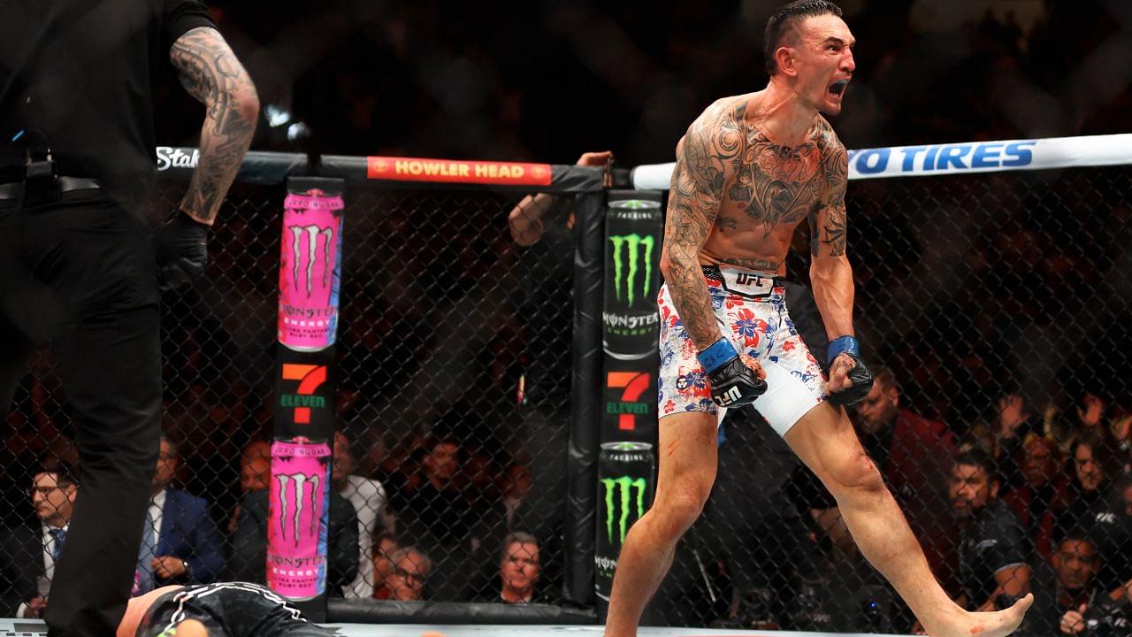 Max Holloway (blue gloves) reacts after defeating Justin Gaethje (red gloves) during UFC 300 at T-Mobile Arena