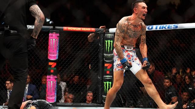 Max Holloway (blue gloves) reacts after defeating Justin Gaethje (red gloves) during UFC 300 at T-Mobile Arena